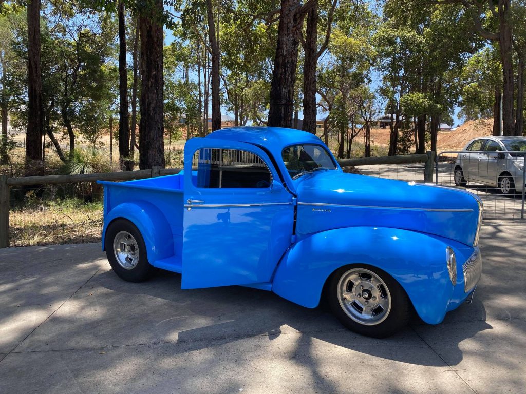 A 1941 blue Willys Coupe