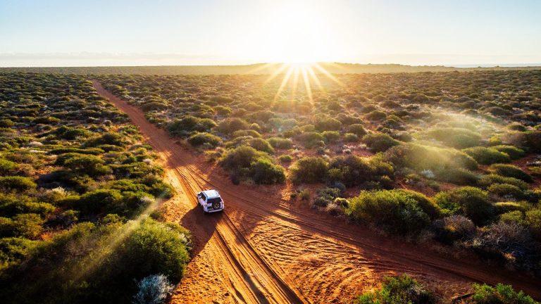 Driving off-road in western Australia at sunset
